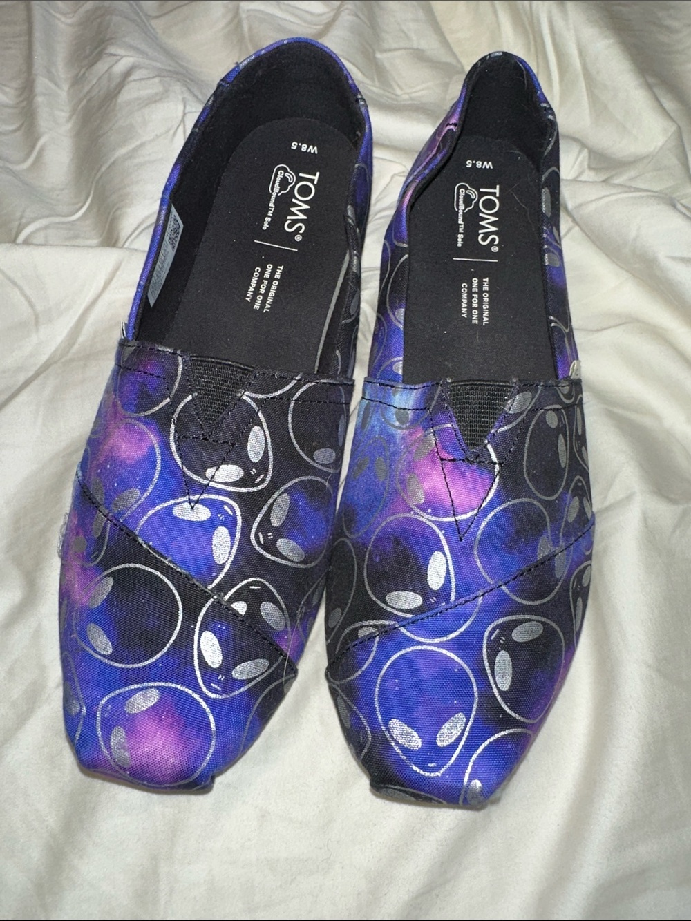 TOMS Women’s Purple & Black Alien Print Slip-Ons